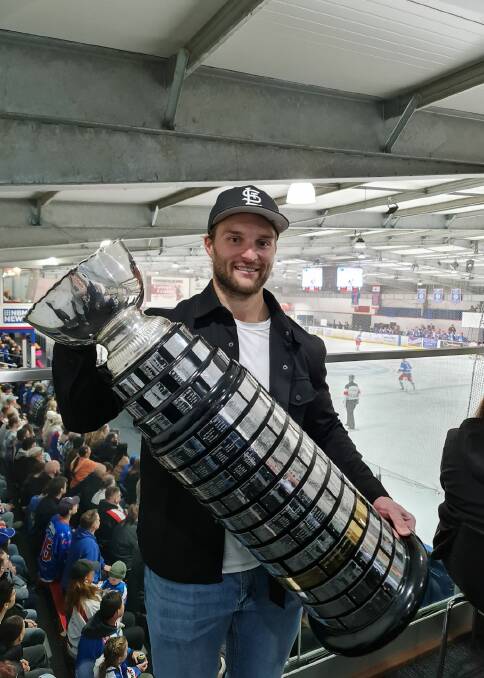 Aussie NHL star Nathan Walker with the Goodall Cup in Newcastle on Saturday. Picture by Courtney Kynaston
