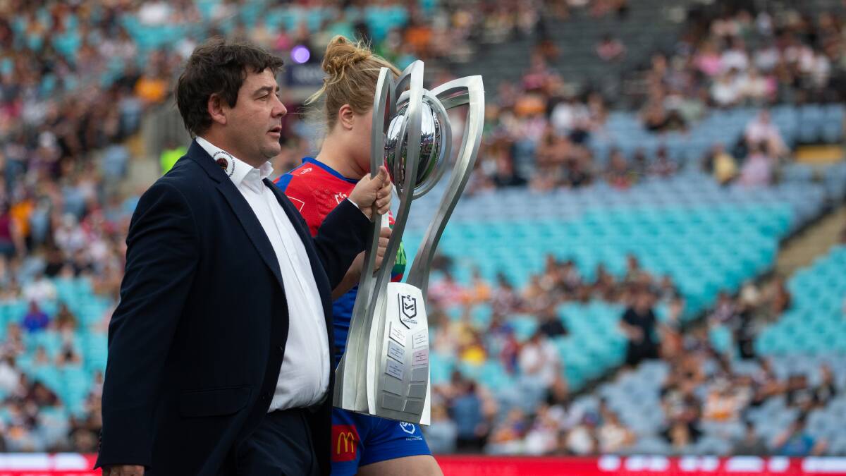 Knights coach Ron Griffiths and captain Hannah Southwell with the NRLW trophy. Picture by Marina Neil
