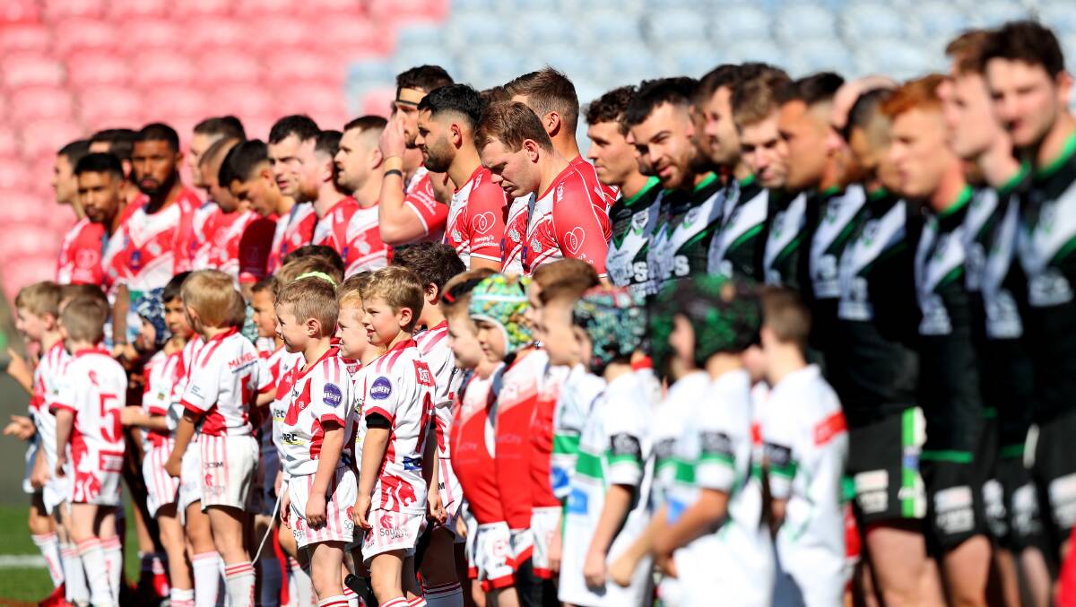 Souths and Maitland players line up before the Newcastle RL grand final at McDonald Jones Stadium on Saturday. Picture by Peter Lorimer