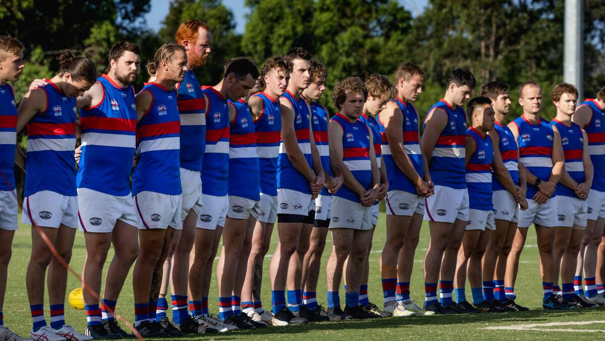 Warners Bay Bulldogs line up before this year's Anzac Day clash. Picture by Marina Neil