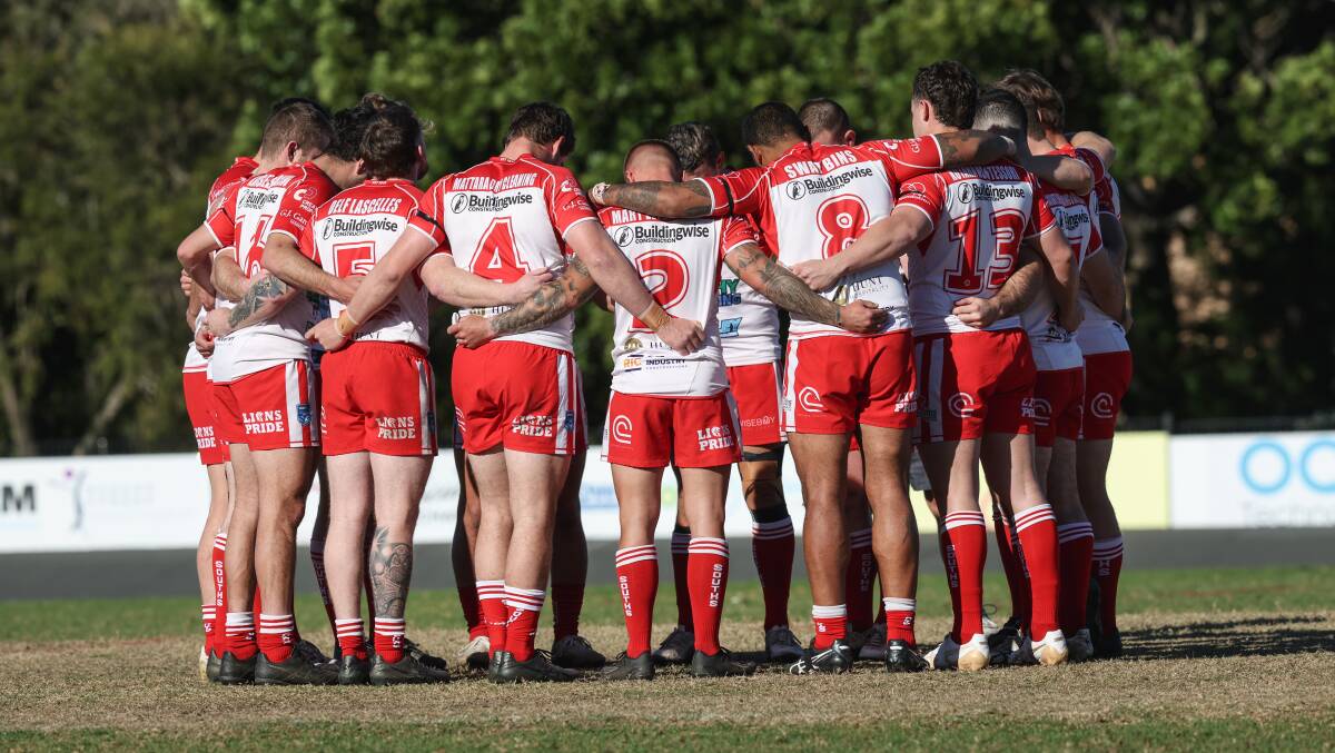 Souths players stand arm-in-arm at Townson Oval last weekend. Picture by Marina Neil