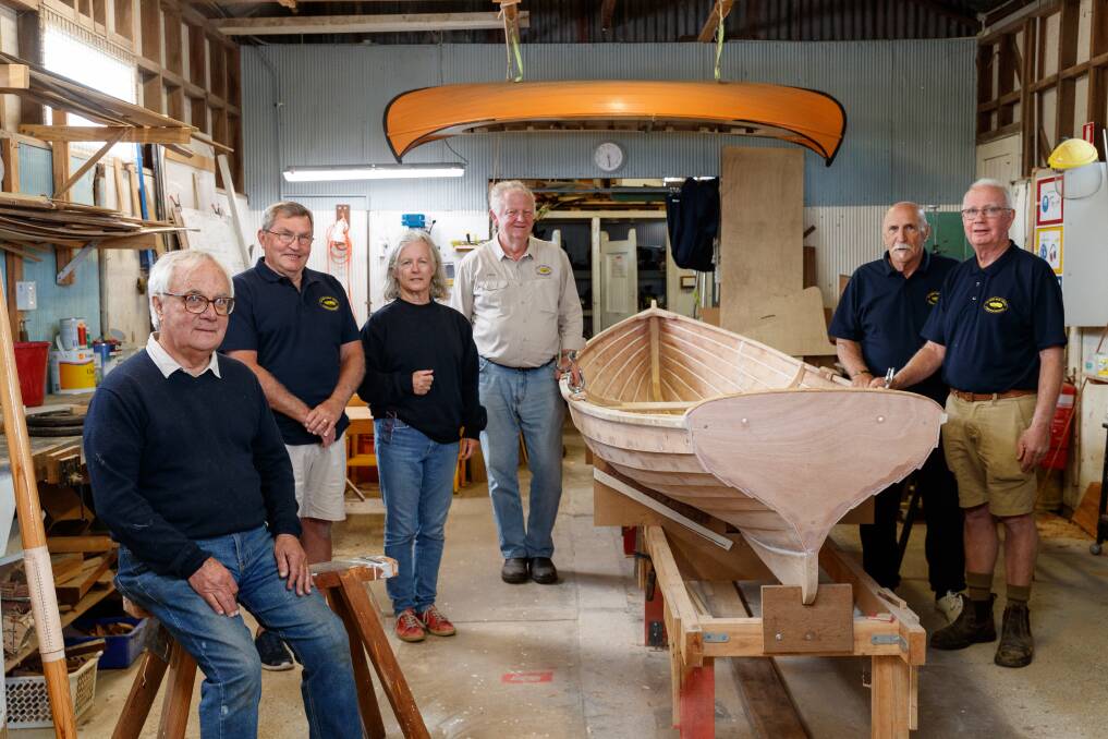 Lake Macquarie Classic Boat Association members Bill Coote, Peter Currie, Lyndal Coote, Stephen Price, Mario Macchia and John O'Neill at the shed at Rathmines where they restore wooden boats. Picture by Max Mason-Hubers