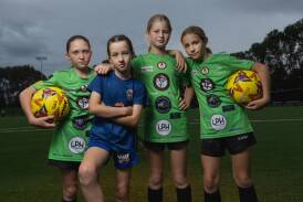 Young Jets supporters Stella Lowe, Mia Tucker, Eden Andoni and Airlie Sullivan at the Lake Macquarie Regional Football Facility. Picture by Marina Neil 