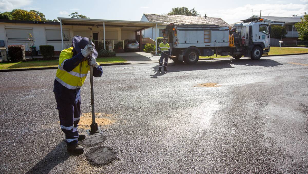 Lake Macquarie maintenance crew member Atunaisa Turagabeci and minor asphalt works supervisor Chris Layzell repairing potholes in Cardiff earlier this year. Picture supplied 