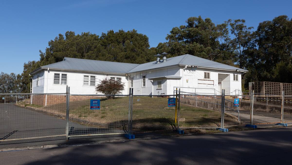 The Westlakes Community Centre remains fenced off until Lake Macquarie council can complete remediation works. Picture by Jonathan Carroll 