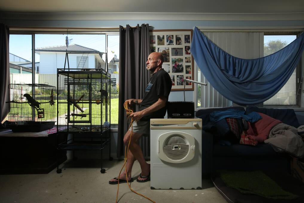 Belmont resident Mark Crockett inside his home, which has been damaged by stormwater. Picture by Simone De Peak 