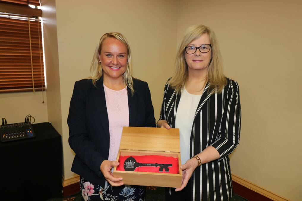 PARTING GIFT: Lord mayor Nuatali Nelmes presents outgoing University of Newcastle vice-chancellor Caroline McMillen with the key to the city. Picture: Newcastle City Council