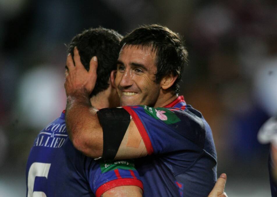 NRL Immortal Andrew Johns embraces Jarrod Mullen during a game against Manly in 2006. Picture by Glen McCurtayne