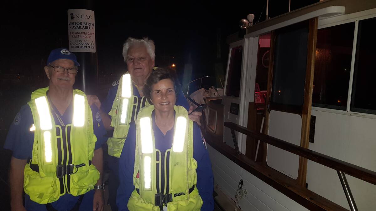 RESCUERS: Marine Rescue volunteers Rick Nevile, Ron Calman and Lynette Van-Homrigh were the crew who helped haul the flybridge cruiser into Newcastle Harbour in the early hours of Tuesday. Picture: Marine Rescue NSW