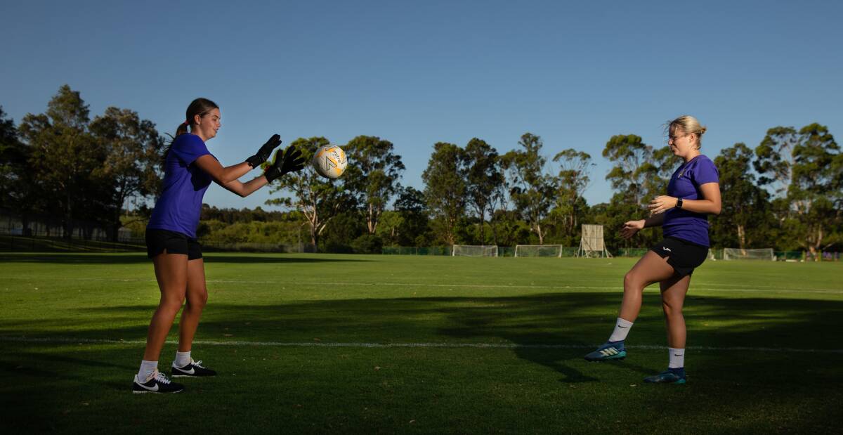 BACK IN ACTION: Ruby Jones, left, trains with older sister and Broadmeadow Magic teammate Ellie. Ruby, 18, has returned after a major injury setback last year. Picture: Marina Neil