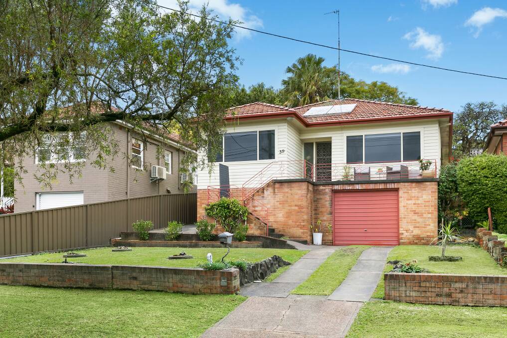 ENTRY LEVEL: This four-bedroom home in New Lambton with views of Blackbutt Reserve has been listed with a price guide of $725,000 to $775,000.