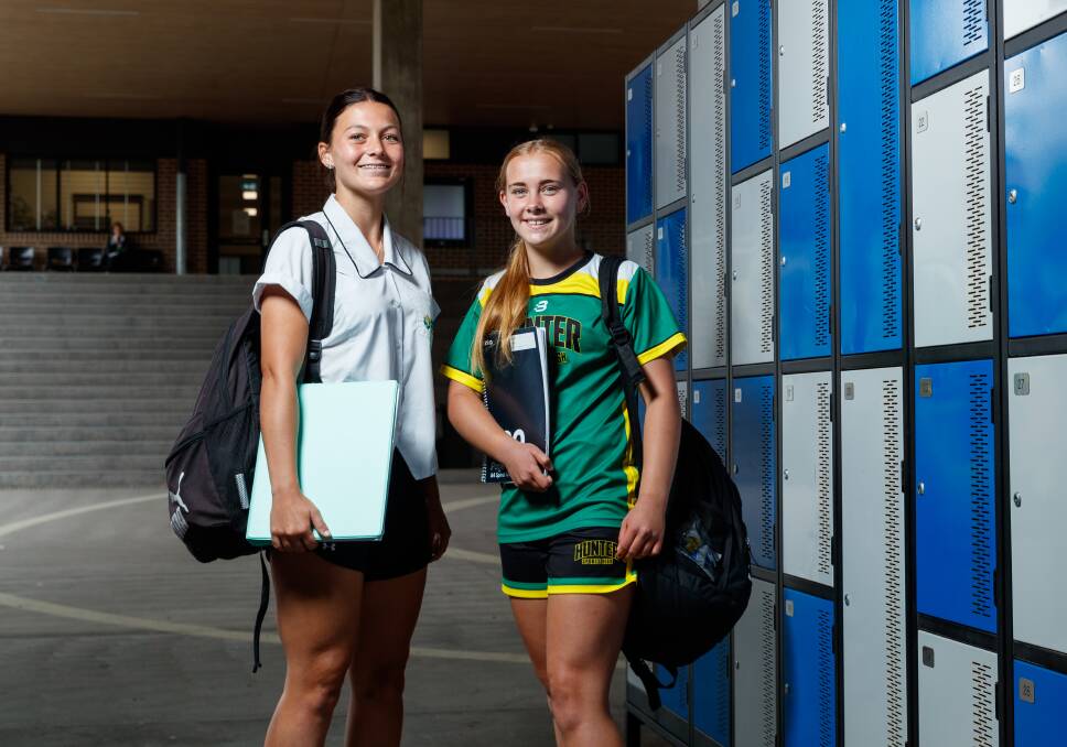 Jets scholarship players Chloe Walandouw, left, and Josie Allan at Hunter Sports High School on Monday. Picture by Max Mason-Hubers