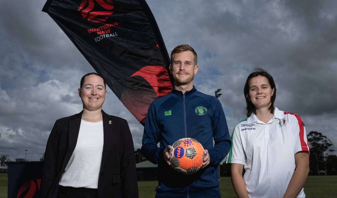 From left, Annelise Rosnell, general manager NSW Football Legacy, with Hamilton Azzurri's Thomas Kane and Natalie Boyd. Picture by Marina Neil