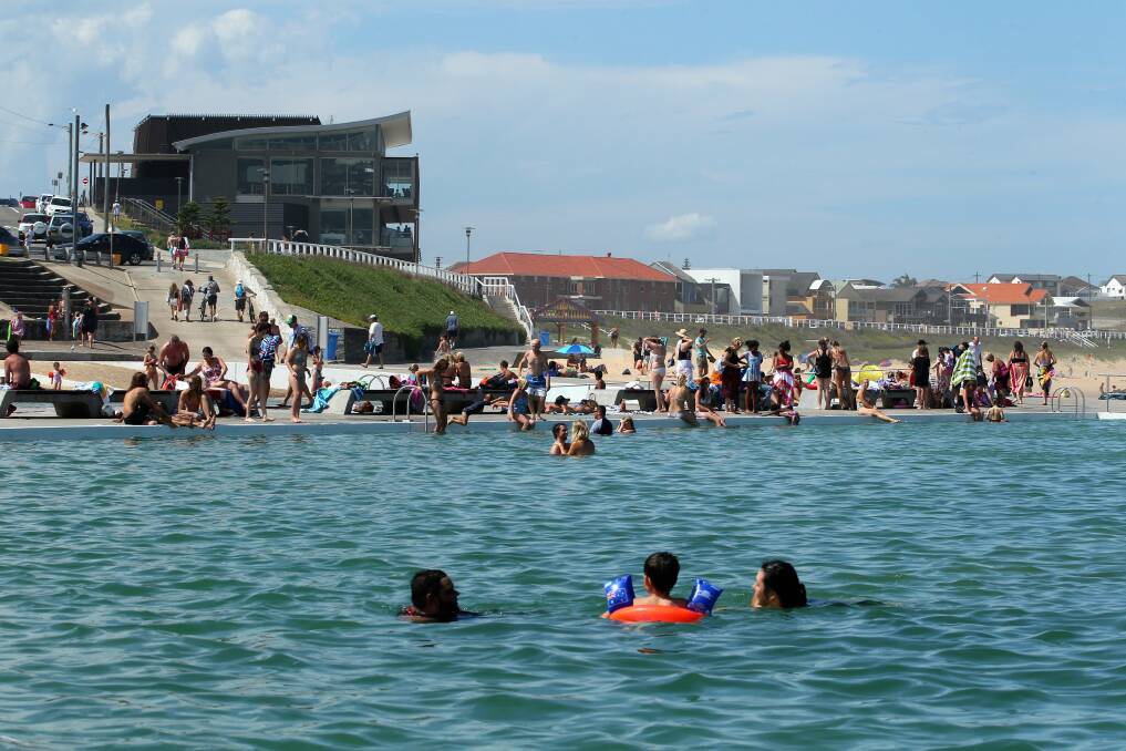OLD AND NEW: The ever-popular Merewether Ocean Baths were built in the 1920s. Merewether Surfhouse was constructed in 2011. Picture: Max Mason-Hubers