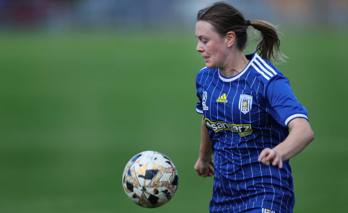 Marion Dunbabin on the ball for Newcastle Olympic this season. Picture by Marina Neil