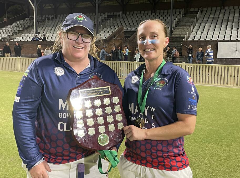 Waratah-Mayfield captains Skye Lovett and Emma-Jayne Howe with the NDCA women's trophy after winning last year's final against Newcastle City. 