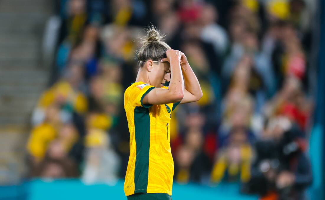 Steph Catley processes in the moment after Australia succumbed 3-1 to England at Stadium Australia on Wednesday night. Picture by Anna Warr