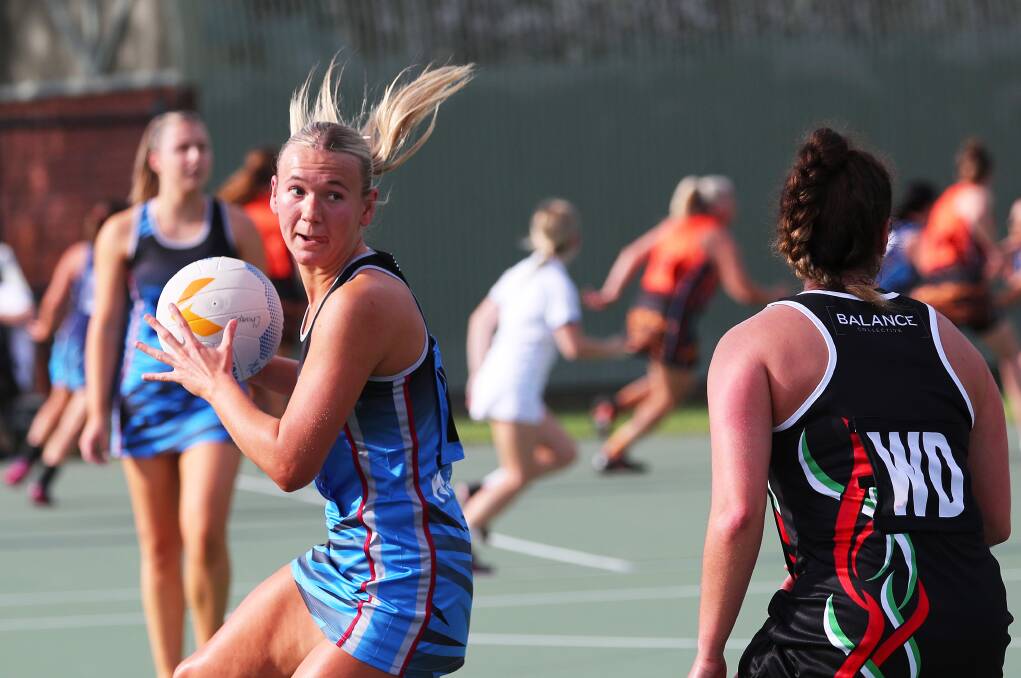 Action between University of Newcastle and West Leagues Balance in round one of Newcastle championship netball on Saturday. Picture by Peter Lorimer