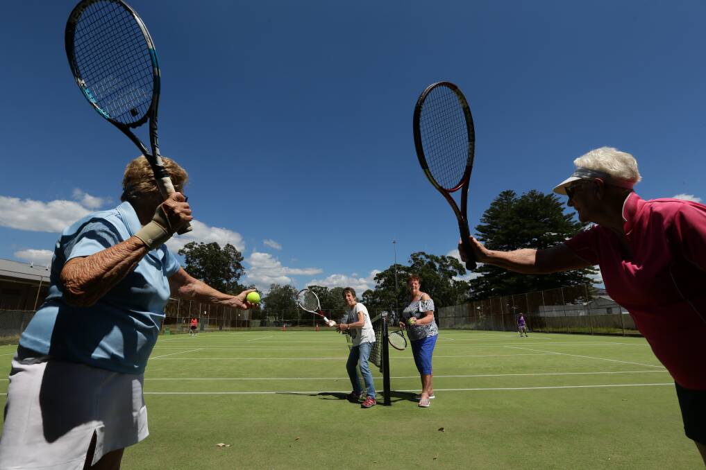 At the net are Lakeside Tennis Group's oldest player Barbara Weimer, left, with long-serving secretary Maria Tillock. Far left is Di Lechelt and far right is Ann Malone. Picture by Jonathan Carroll