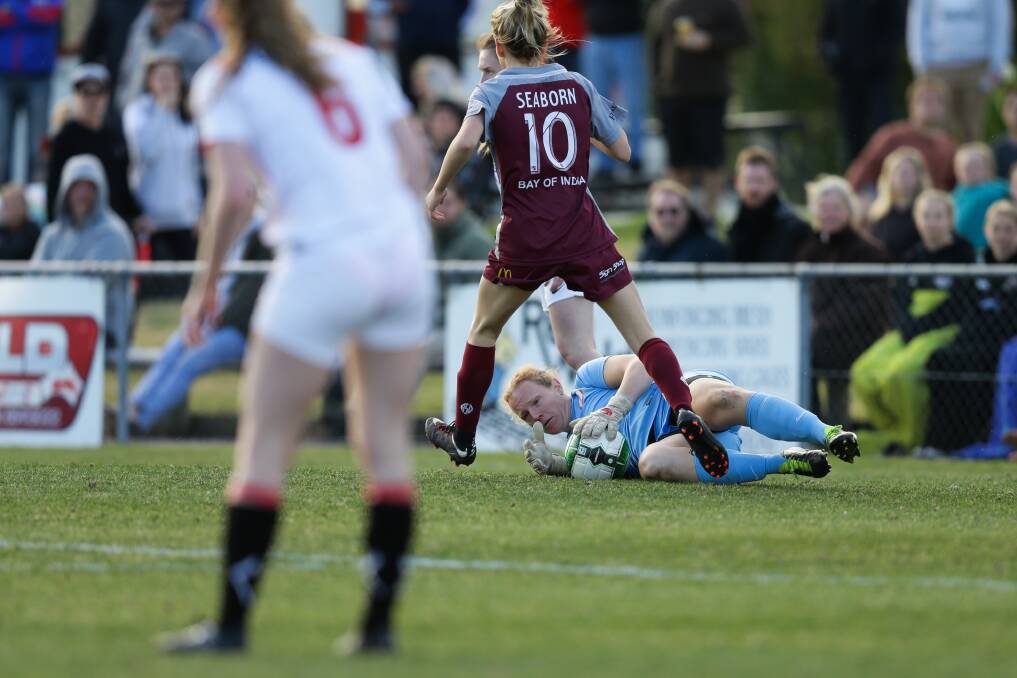 BODY ON THE LINE: Merewether goalkeeper Alison Logue in action during last year's grand final against Warners Bay. Picture: Jonathan Carroll