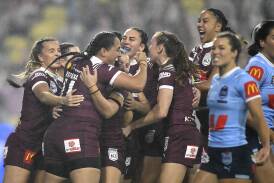 Queensland celebrate a try in Origin III in Townsville on June 27. Picture Getty Images