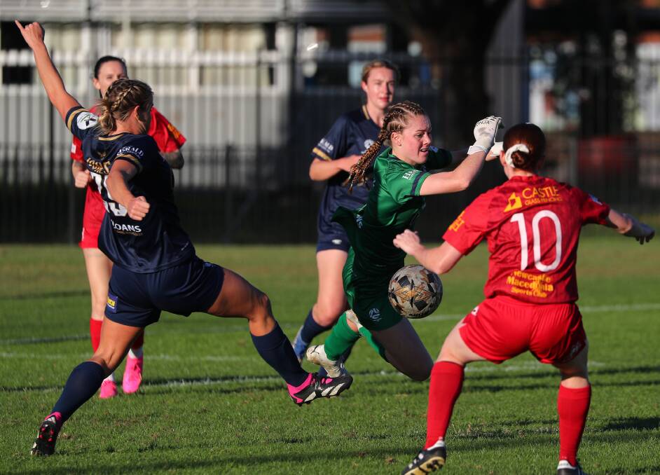 Broadmeadow Magic forward Lucy Jerram gets one past New Lambton goalkeeper Ally Boertje for the second goal of a match double at Alder Park on Sunday. Picture by Peter Lorimer