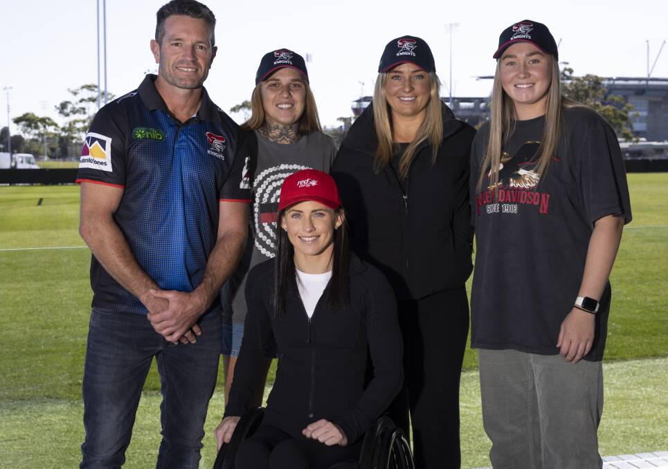 Knights legend Danny Buderus and Newcastle Paralympian Lauren Parker, both Red Energy ambassadors, with Newcastle NRLW players Caitlin Moran, Olivia Higgins and Kayla Romaniuk on Saturday. Picture by Red Energy