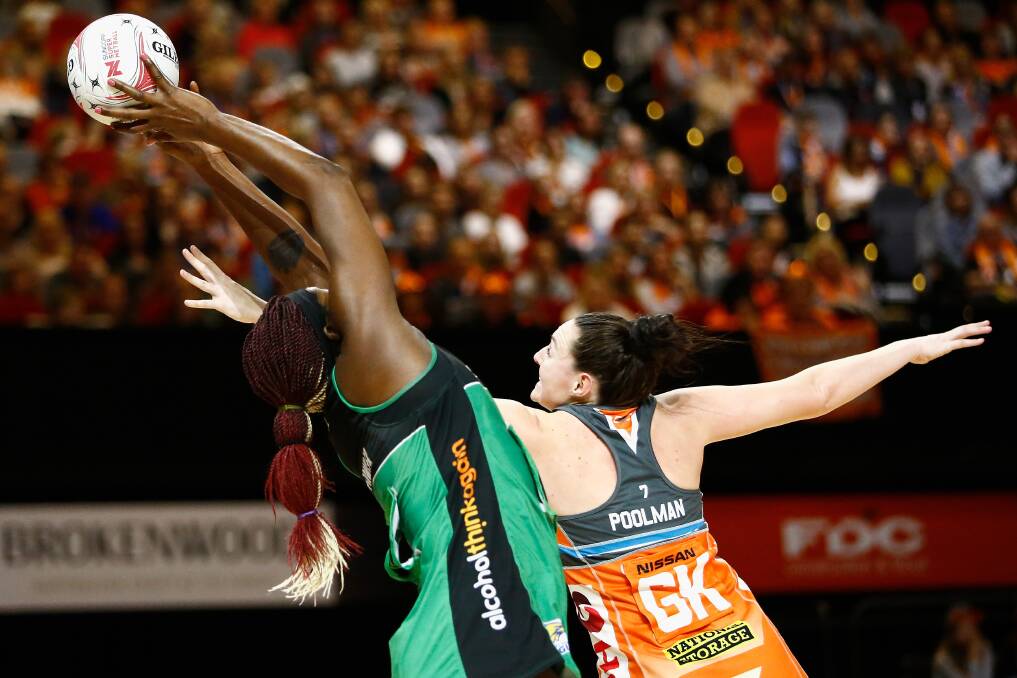 DETERMINED: GWS Giants' Sam Poolman, right, in action against West Coast Fever in Super Netball at the International Convention Centre in Sydney on August 4. Picture: AAP Images