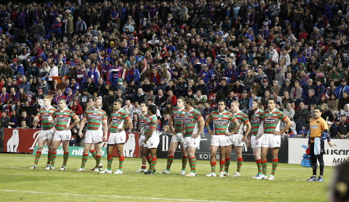 South Sydney players after conceding a try and the 2011 crowd. Picture by Ryan Osland