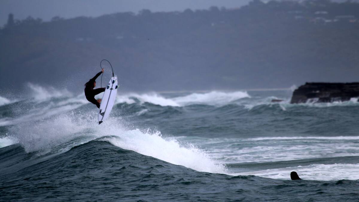 AIRTIME: A surfer at Newcastle on Wednesday. Picture: Dave Anderson