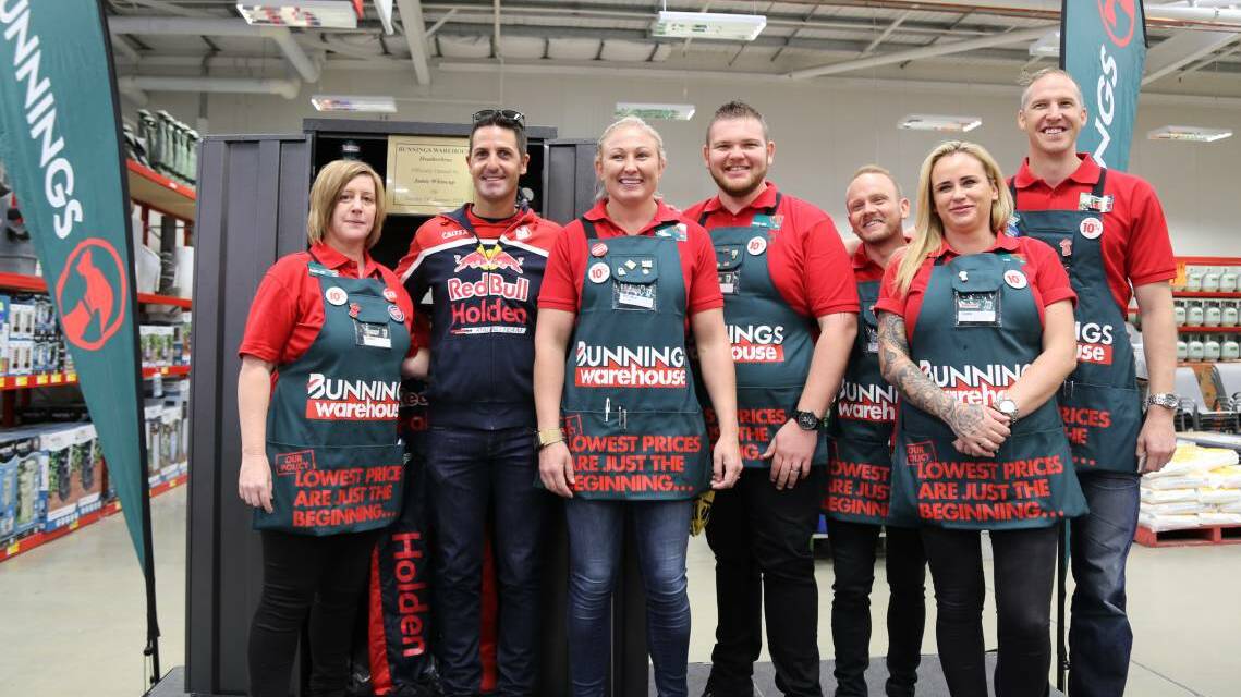 HAPPY CREW: Whincup with the Bunnings staff. Picture: Ellie-Marie Watts.