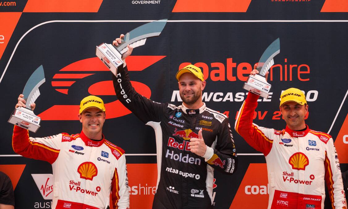 Shane van Gisbergen on the top of the podium after beating rival Scott McLaughlin, left, at Newcastle in 2019. Picture by Max Mason-Hubers 