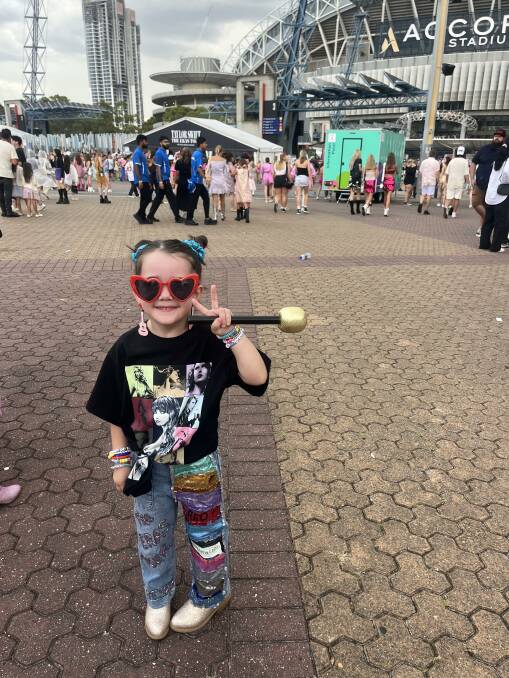 Faith Foster was decked out in bright red heart-shaped glasses, jeans that she painted herself with Swift's album covers, bedazzled boots and a concert shirt that her older cousin scored for her at the merch tent. Picture supplied