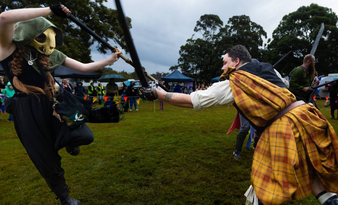 Tara Clark as Ciris the mage does battle with Highlander Matt McLeaod at Pop Bam in Lake Macquarie on Saturday, July 27. Picture by Simon McCarthy 