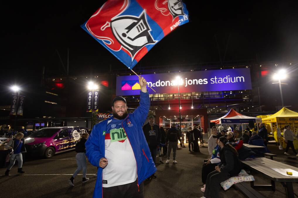 Diehard New Lambton fan Cameron Howard waves the home flag as the NRLW Knights open their campaign for a third consecutive premiership in 2024. Picture by Jonathan Carroll