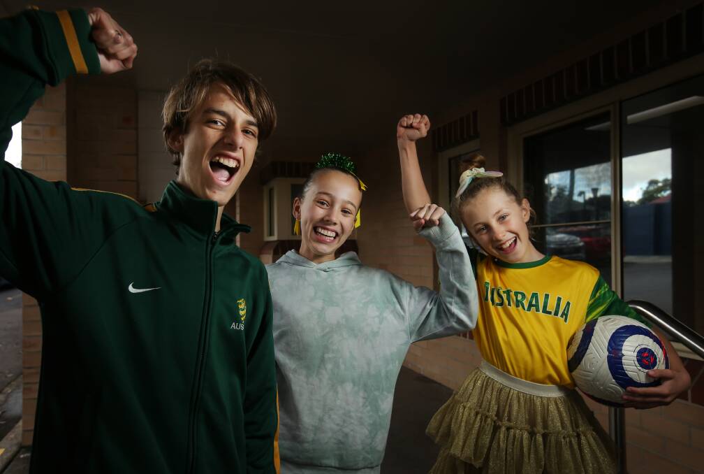 Hunter Christian School students, Ali Lowe, Levi Troyer and Lily Marklew gave their regular uniforms a break on Wednesday to join their school in full Matildas support ahead of their World Cup semi-final clash with England. Picture by Simone De Peak 