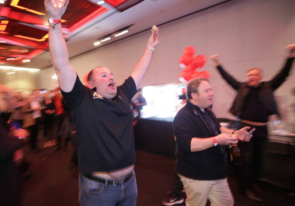 Celebrations: The one bright spot for Labor supporters on election night was news Tony Abbott had been defeated, by an independent, after 25 years as Member for Warringah. Picture: Alex Ellinghausen. 