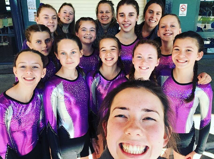 SELFIE: Samantha Nicholls, owner and instructor at Gymnastics 21, is up for a state business award. Here pictured with Gymnastics 21 competitive team. Picture: Supplied
