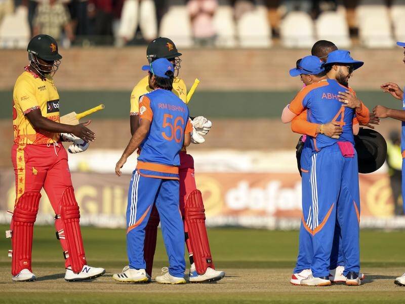 Players shake hands at the end of India's emphatic T20 victory over Zimbabwe in Harare. (AP PHOTO)