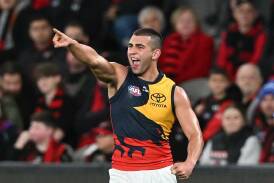 Josh Rachele has kicked a goal in the last minute to give Adelaide a thrilling win over Essendon. Photo: James Ross/AAP PHOTOS