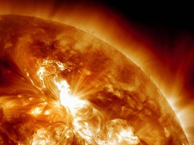 Scientists are monitoring a part of the sun that spit out a flare for a possible outburst of plasma. (AP PHOTO)