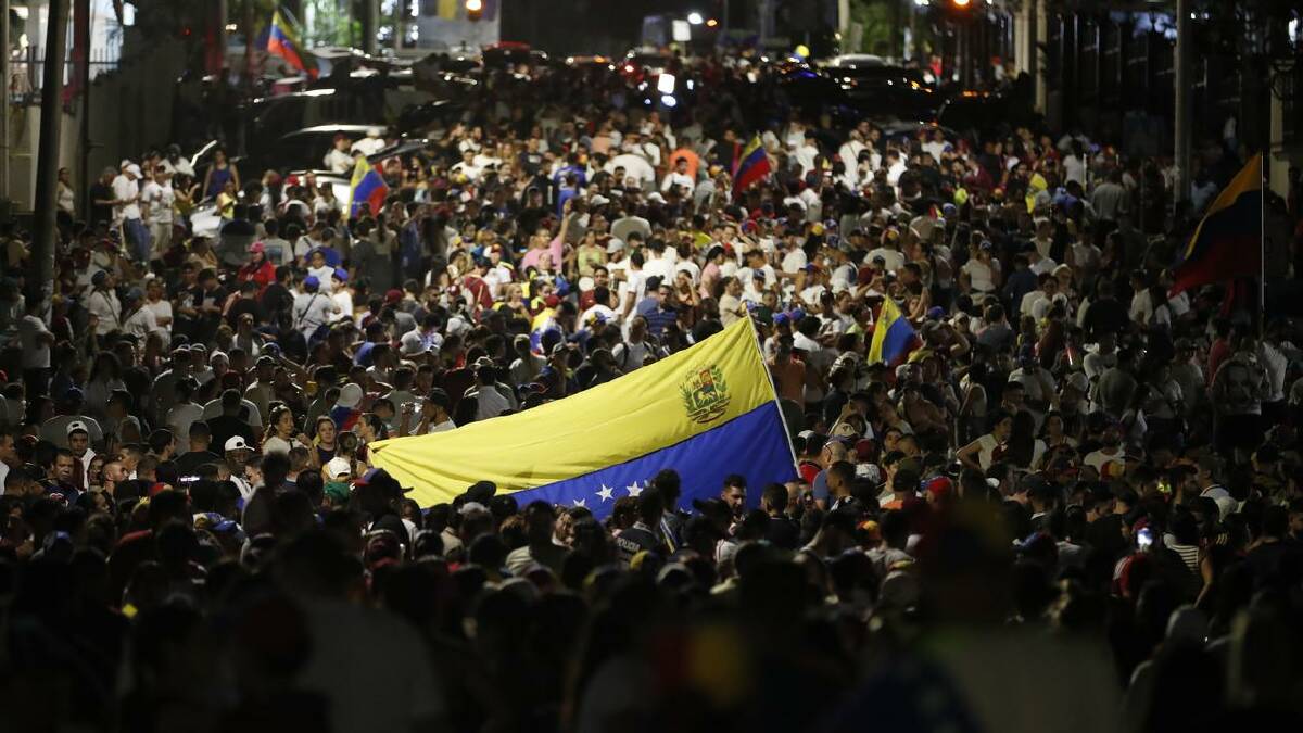 Venezuelan citizens gathered to hear the results of the election from their embassy in Panama. (EPA PHOTO)