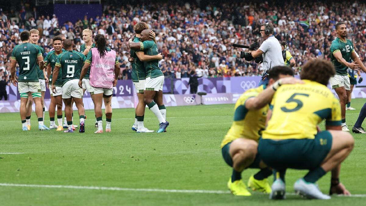 South Africa celebrates rugby sevens bronze over a distraught Australia. (EPA PHOTO)