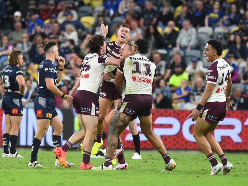 Manly players surround Daly Cherry-Evans after the halfback's dramatic late match-winner. (Scott Radford-Chisholm/AAP PHOTOS)