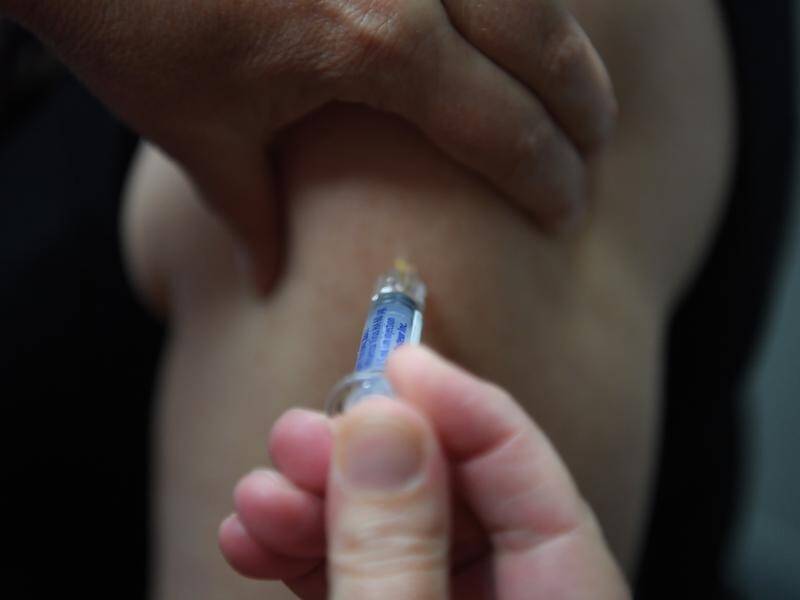 Parents are being urged to watch for flu symptoms in children and get them vaccinated. (Sam Mooy/AAP PHOTOS)