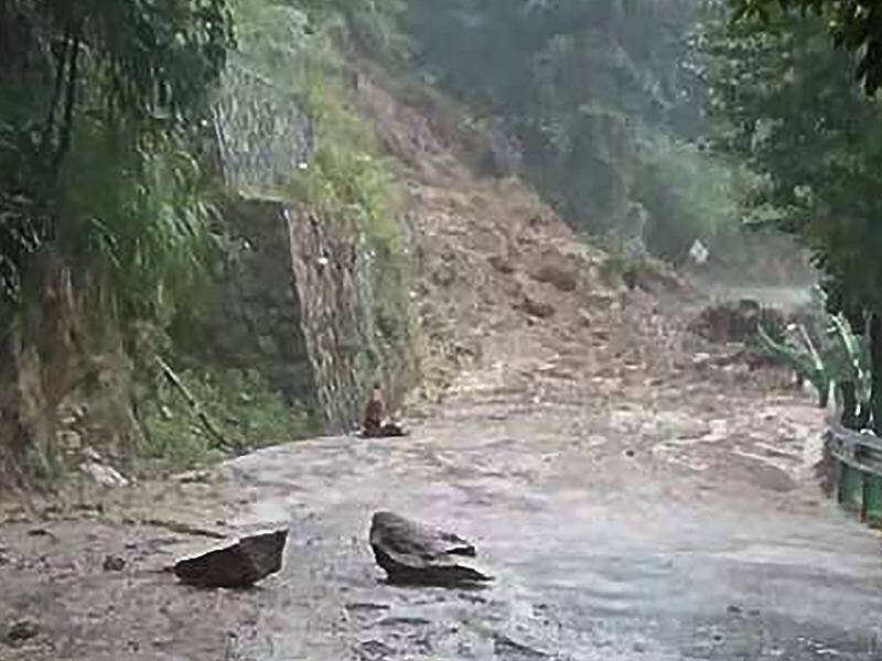 Rain brought by a tropical storm has caused a mudslide in a Chinese village, killing 11. Photo: AP PHOTO
