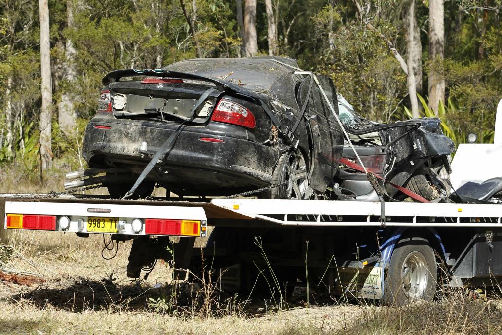 The car is removed from the scene after the fatal crash. Picture: Max Mason-Hubers