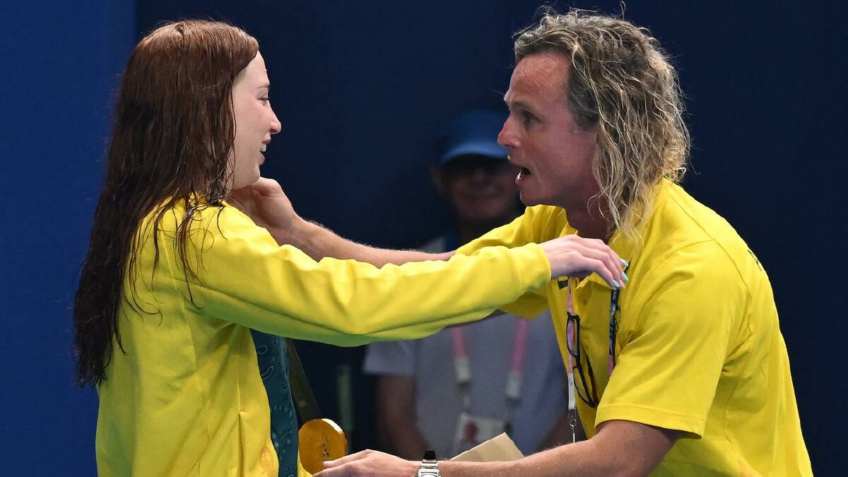 Mollie O'Callaghan reacts with Australian swimming coach Dean Boxall after winning Olympic gold. (Dave Hunt/AAP PHOTOS)