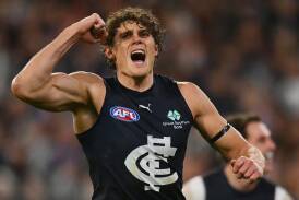 Carlton have defeated Essendon in their MCG blockbuster, with Charlie Curnow kicking two goals. (Morgan Hancock/AAP PHOTOS)