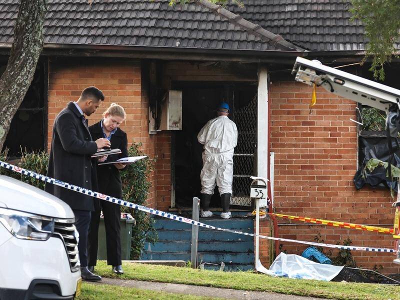 Police arrested a man at the scene of a deadly house fire in Sydney's west. (Mark Evans/AAP PHOTOS)